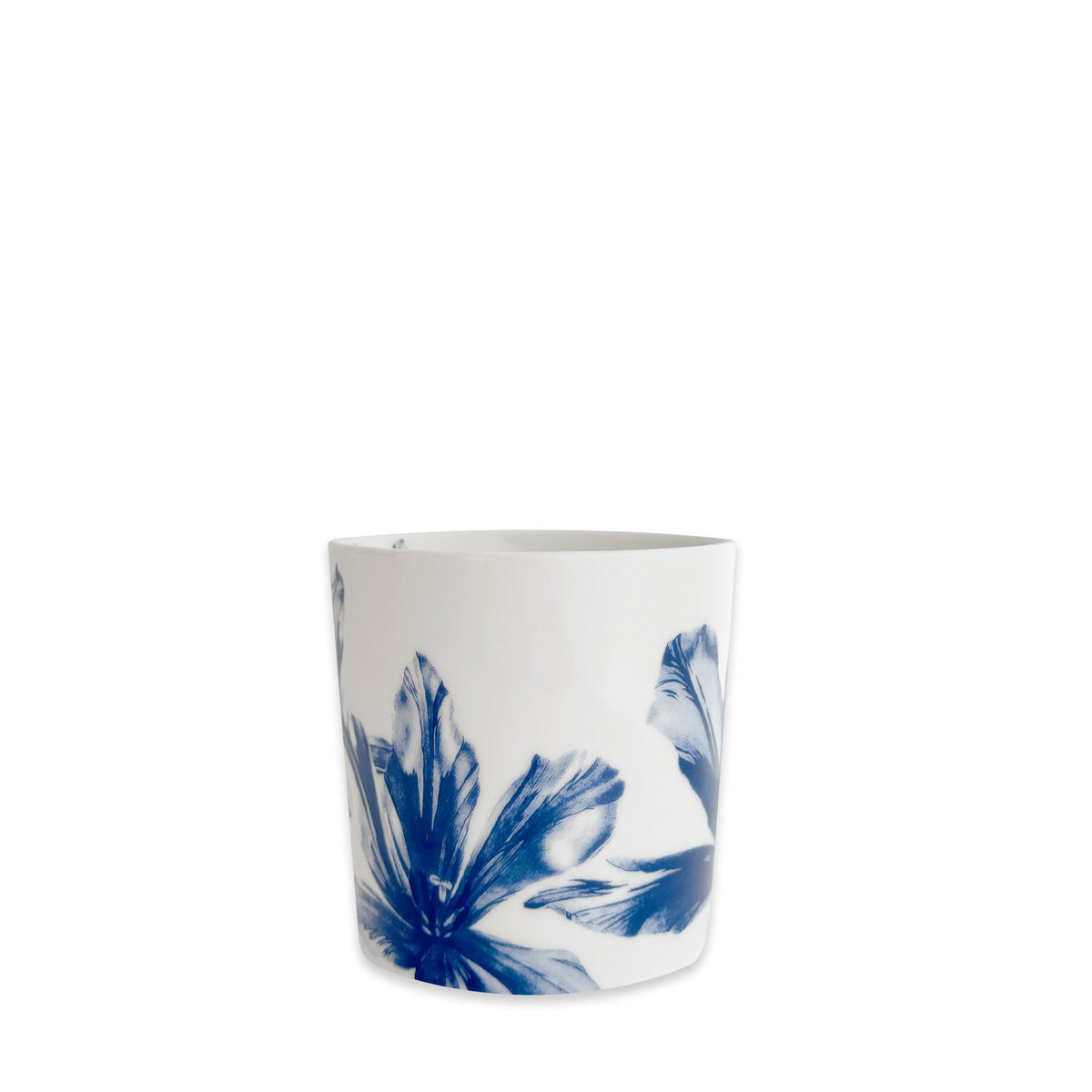 The Caskata Tulip Mug is a white porcelain coffee mug featuring blue abstract floral patterns near the base, shown against a plain white background.