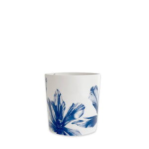 The Caskata Tulip Mug is a white porcelain coffee mug featuring blue abstract floral patterns near the base, shown against a plain white background.