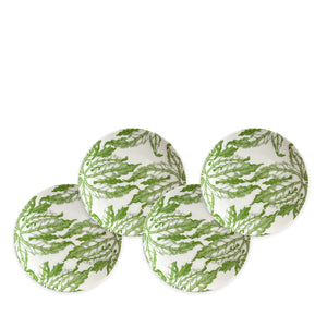 The Greenhouse Luncheon Bundle by Caskata features four round white plates with green leafy patterns, expertly arranged in a staggered formation on a plain background. Ideal for hosting gatherings or refreshing your spring decor.