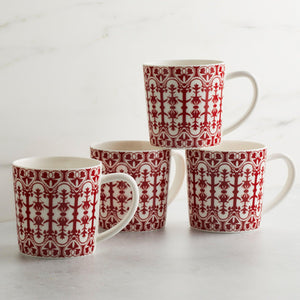 Four Casablanca Crimson mugs by Caskata Artisanal Home on a marble surface.
