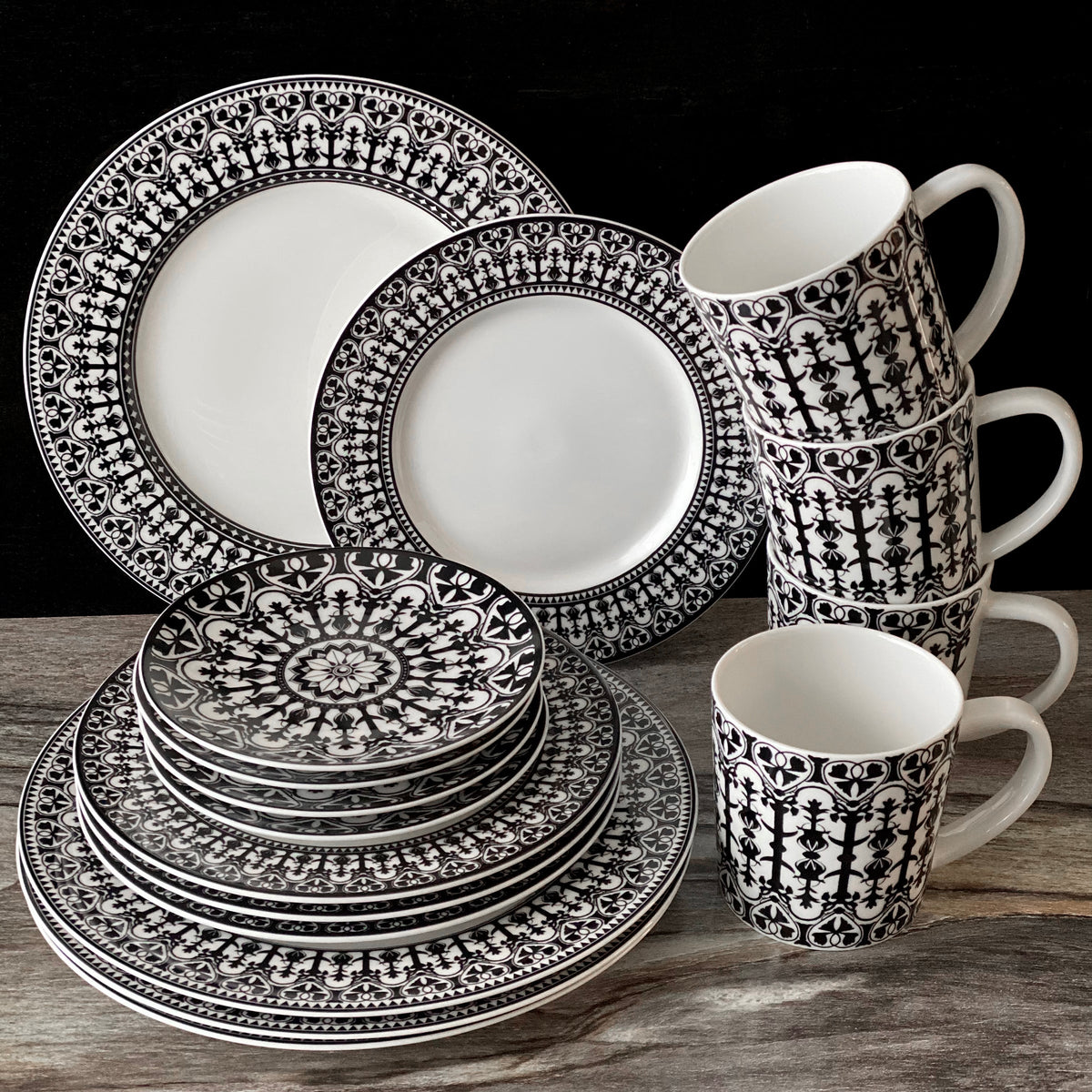 A set of Casablanca Mug Black dinnerware inspired by Caskata Artisanal Home on a table.