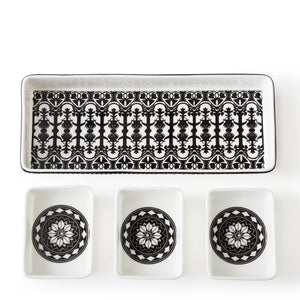 A Casablanca nested tray set by Caskata featuring three bone china bowls, all elegantly displayed in black and white. Perfect for serving a variety of delicious dishes.
