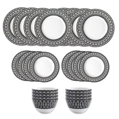 The Caskata Casablanca Table for 8 is a 24-piece porcelain dinnerware set with patterned black and white plates and bowls, displayed in rows on a white background. Dishwasher and microwave safe.