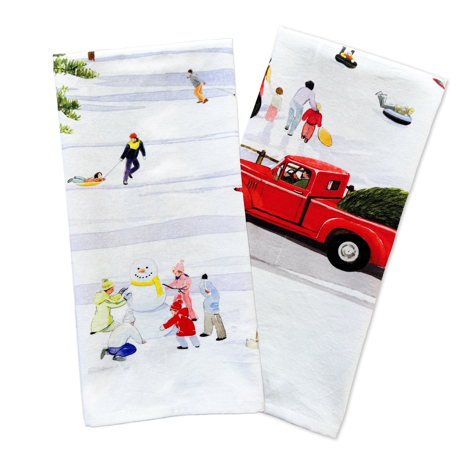 The Caskata X Felix Doolittle Winter Wonderland Kitchen Towels, Set of 2, showcase winter scenes such as skating, sledding, building a snowman, and a red truck transporting holiday cargo.