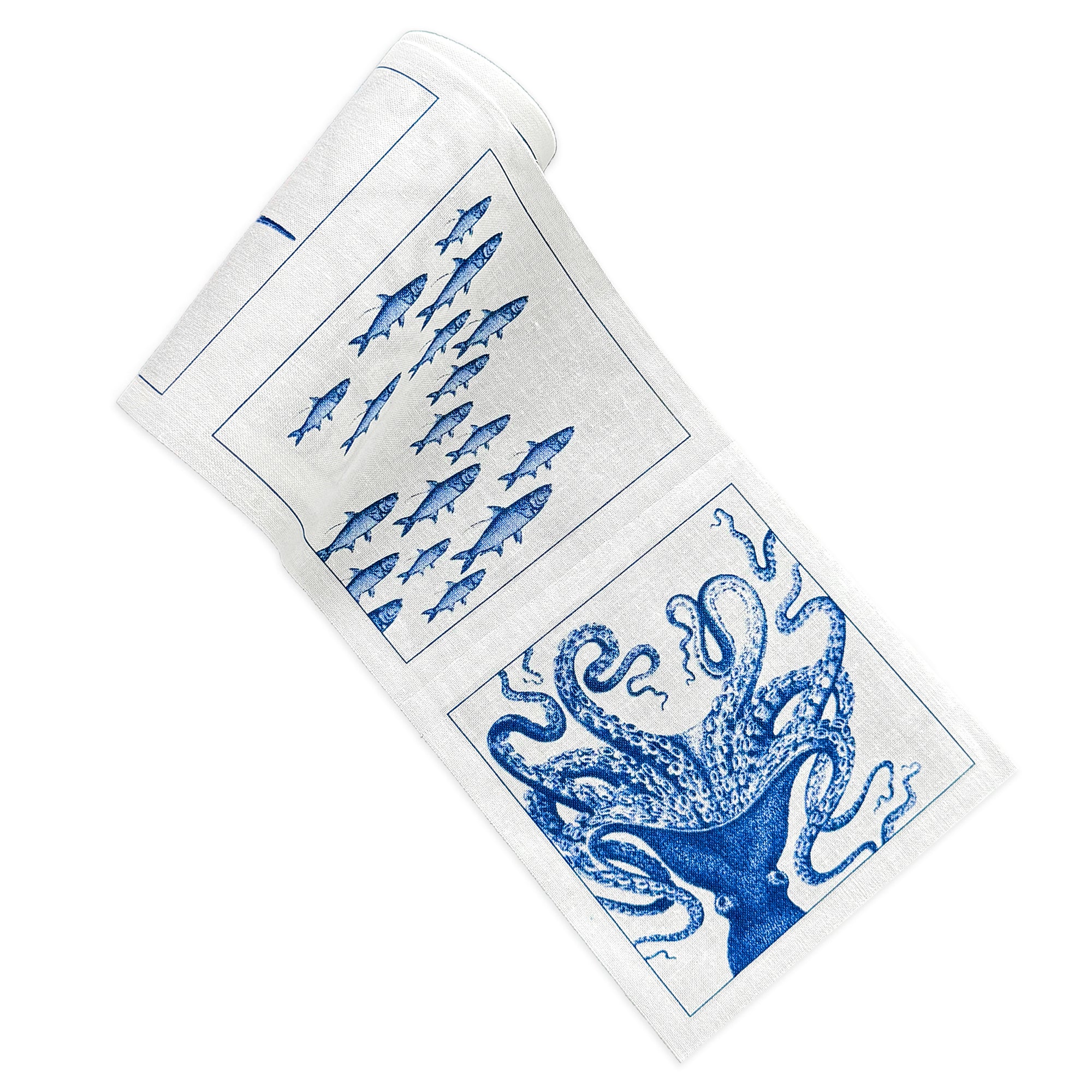 A rolled-up Coastal Cocktail Napkin Roll by MY DRAP with blue illustrations of fish and an octopus, perfect as a beach-lover's gift.