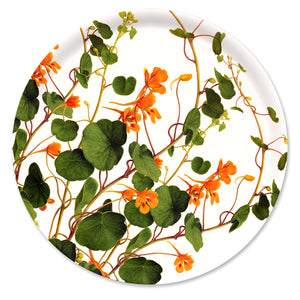 The Nasturtiums Large Round Birchwood Tray by Caskata showcases a botanical design with orange flowers and green leaves on a white background, made from sustainable materials.