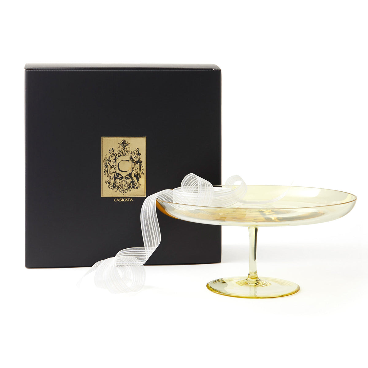 The Caskata Celia Citrine Cake Pedestal is perfect for displaying your delicious creations. This gold cake stand comes with a ribbon and box, adding an extra touch of glamour reminiscent of glamorous New York City.