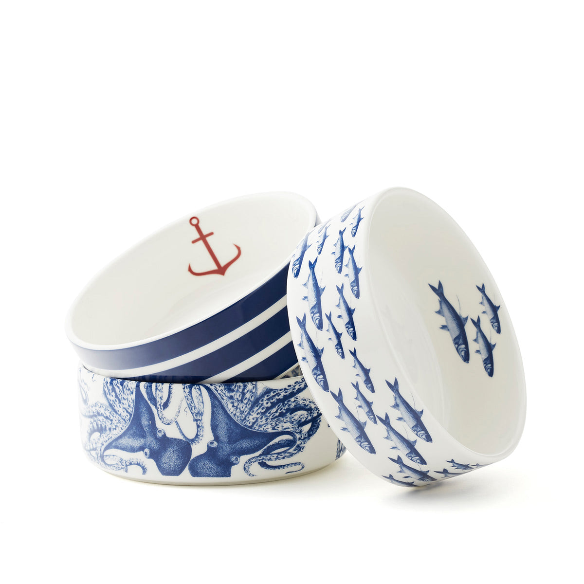 Coastal - School of Fish, Beach Towel Stripe and Lucy the Octopus medium pet bowls. Premium porcelain from Caskata.