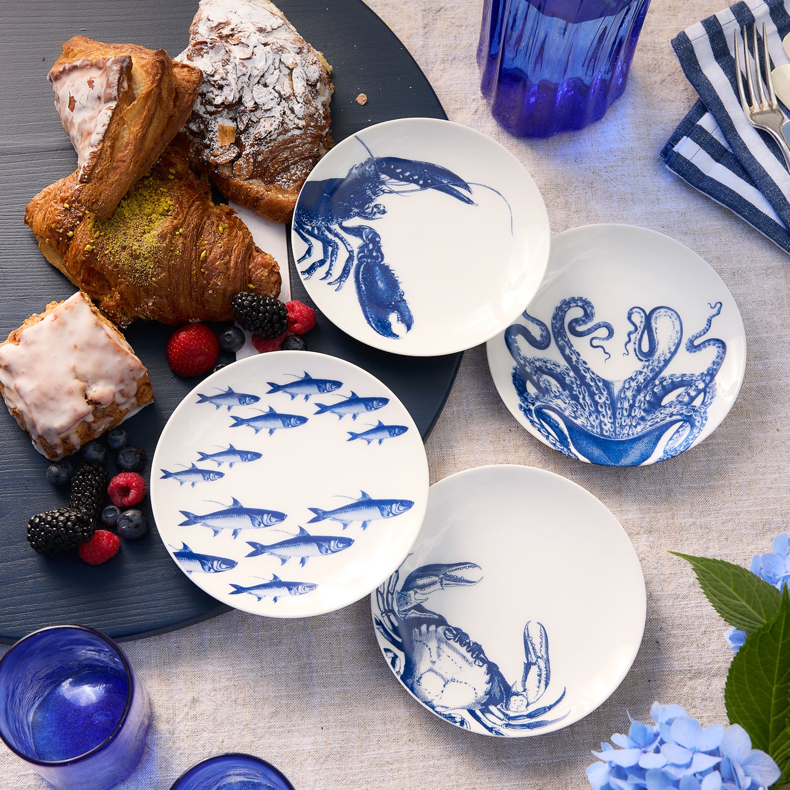 Mixed set of 4 small canape plates for appetizers in iconic Caskata Coastal patterns including Lucy the Octopus, School of Fish, Crab and Lobster.