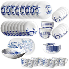 The Caskata Crab Ultimate Set is a 32-piece collection of beach-themed dishes with blue crab and net designs, including plates, bowls, and mugs—perfect for seaside style.