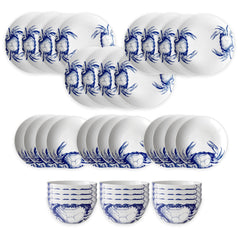 The Caskata Crab Table for 12 is a 36-piece porcelain dinnerware set with blue crab patterns on plates and bowls, all neatly displayed on a white background.