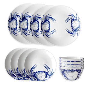 Caskata's Crab Table for 4 is a porcelain set with six white dinner plates, salad plates, and bowls, all featuring a charming blue crabs pattern. This dishwasher-safe dinnerware offers easy cleanup and stylish dining.