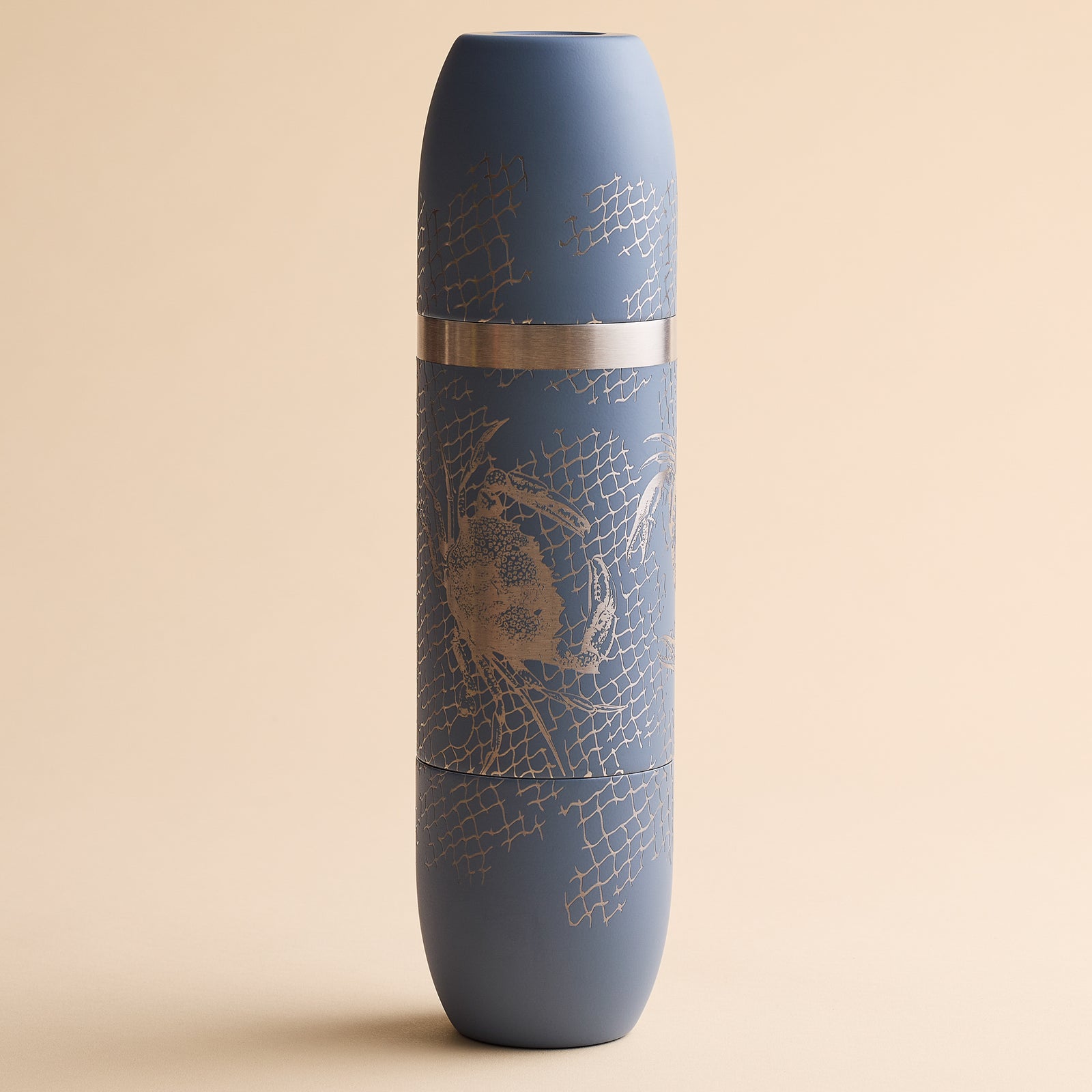 Caskata x High Camp Dark Gray Crabs & Nets Wine Flask in dark gray with a silver etched pattern of crabs and fishing nets.