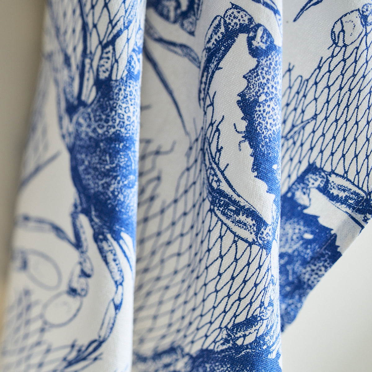 A blue and white Crabs &amp; Nets Kitchen Towels Set/2 featuring blue crabs, bringing seafaring whimsy to your everyday Caskata kitchen towels.