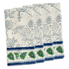 Caskata’s Cuttyhunk Block Print Dinner Napkins feature blue floral patterns and a green-blue leaf border—four folded cotton napkins, slightly overlapping, ideal for a stylish bohemian table setting.