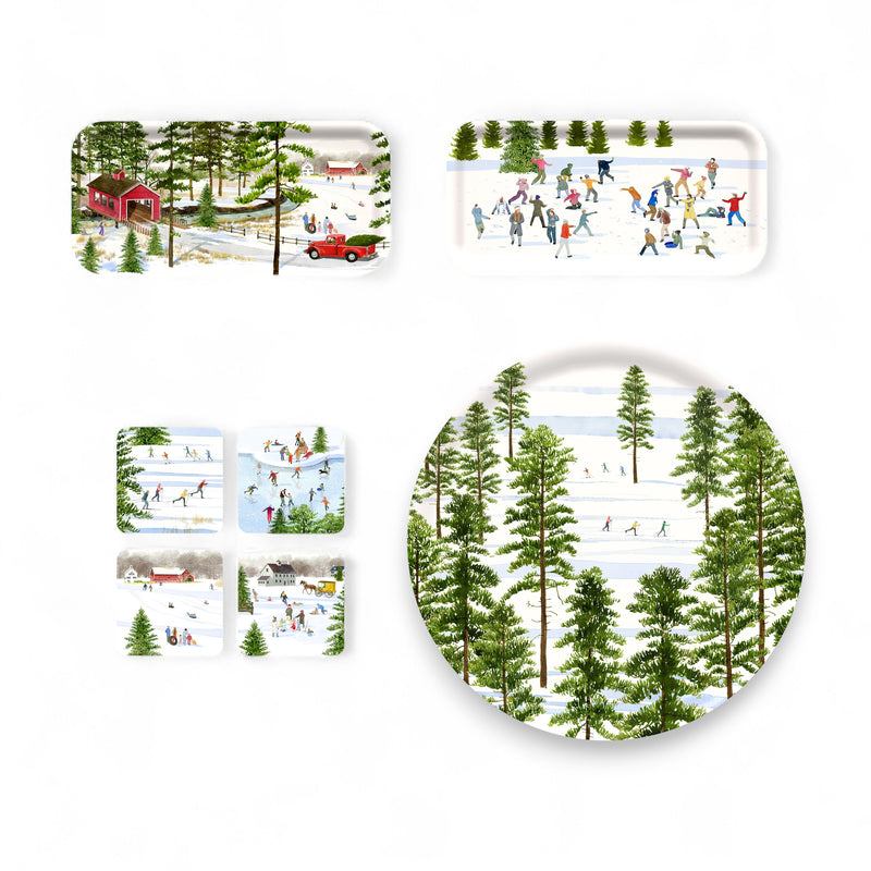 The Felix Doolittle "Deluxe Doolittle" Bundle includes watercolor trays and plates with winter scenes—ice skating, snowy landscapes, trees, and a red covered bridge—perfect for holiday decor.
