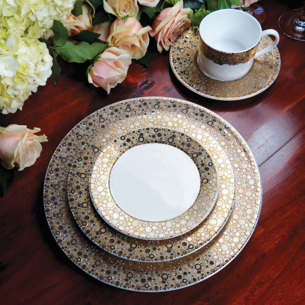 An elegantly harmonious Ellington Shimmer Gold &amp; Platinum Salad Plate made of precious metals on a table by Caskata Artisanal Home.