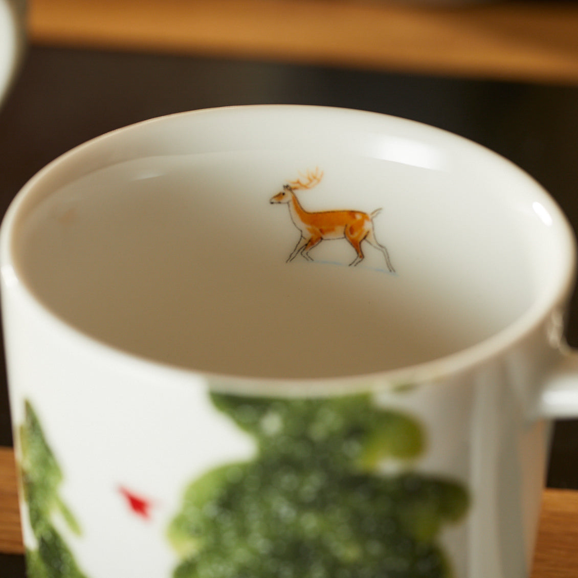 A photo of the deer detail on the inside of one of the Caskata X Felix Dolittle Winter Collaboration Porcelain Mugs Set of 4