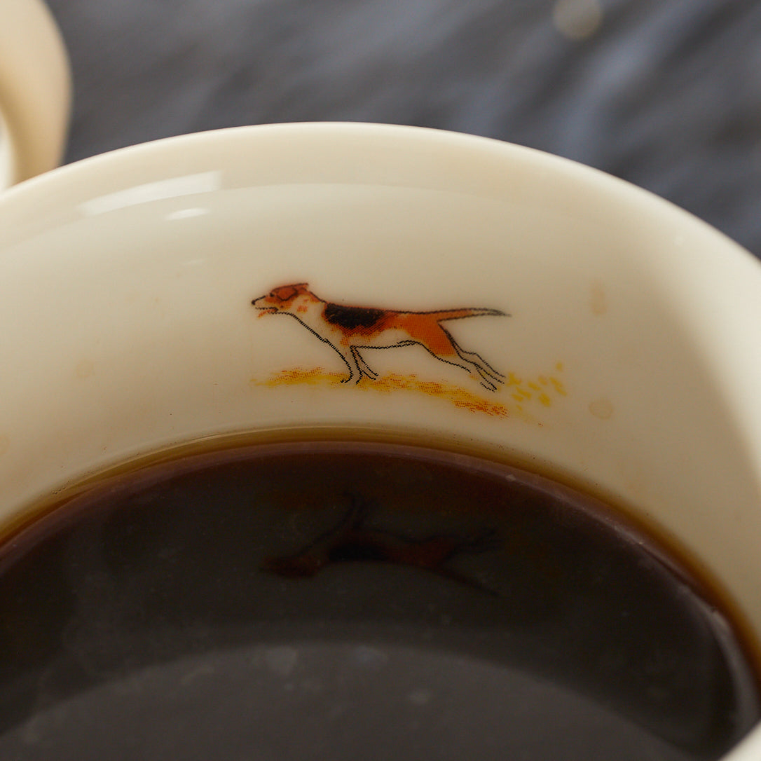 A detail of the dog illustration inside one of the Caskata X Felix Dolittle Autumn Collaboration Porcelain Mug Set of 4