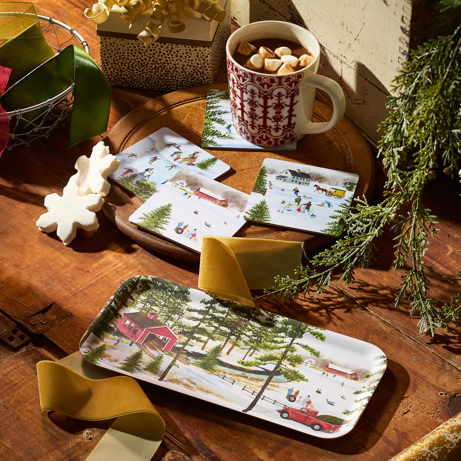The Caskata X Felix Doolittle Sledding Small Rectangular Tray by Caskata features a snowy rural scene with a red bridge, children sledding, and a festive truck, beautifully crafted from sustainable birchwood in Finland.