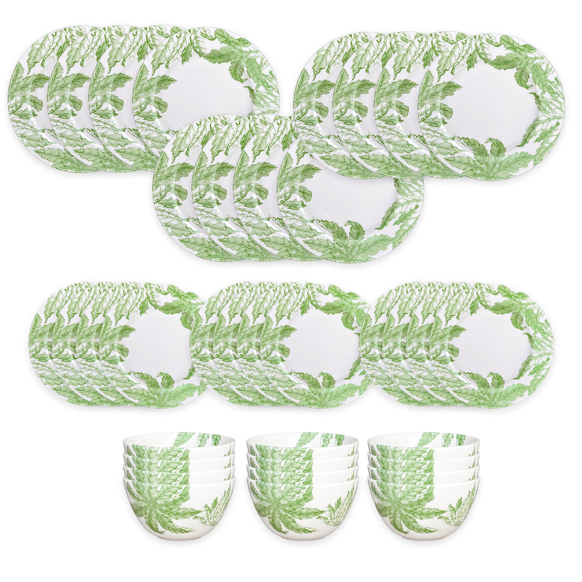 The Caskata Freya Table for 12 is a 36-piece porcelain dinnerware set with white plates and bowls adorned with green fern leaf patterns. Dishwasher and microwave safe, it offers everyday convenience and style.