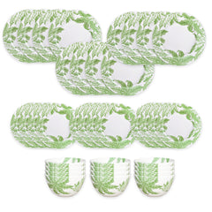 The Caskata Freya Table for 12 is a 36-piece porcelain dinnerware set with white plates and bowls adorned with green fern leaf patterns. Dishwasher and microwave safe, it offers everyday convenience and style.
