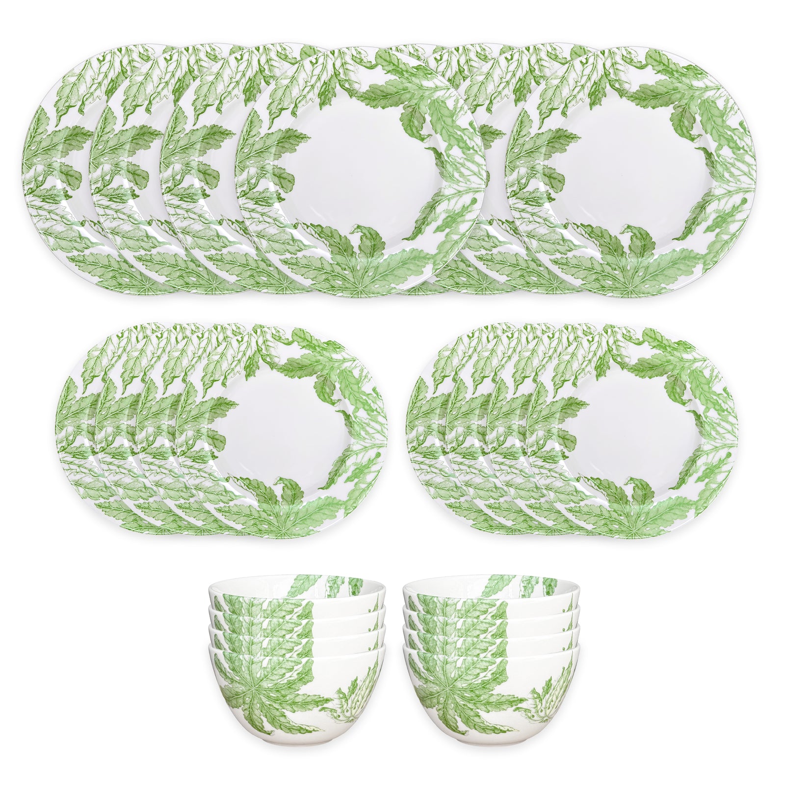 The Caskata Freya Table for 8 is a 24-piece porcelain dinnerware set with green leafy patterns on white; includes plates and bowls that are both dishwasher and microwave safe for convenience.
