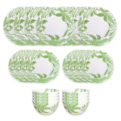 The Caskata Freya Table for 8 is a 24-piece porcelain dinnerware set with green leafy patterns on white; includes plates and bowls that are both dishwasher and microwave safe for convenience.