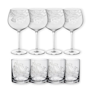 The "Cocktails with Lucy" Bundle by Caskata includes eight clear glasses—four tall wine and four short rocks glasses—each etched with an octopus design, arranged in two rows on a white background.