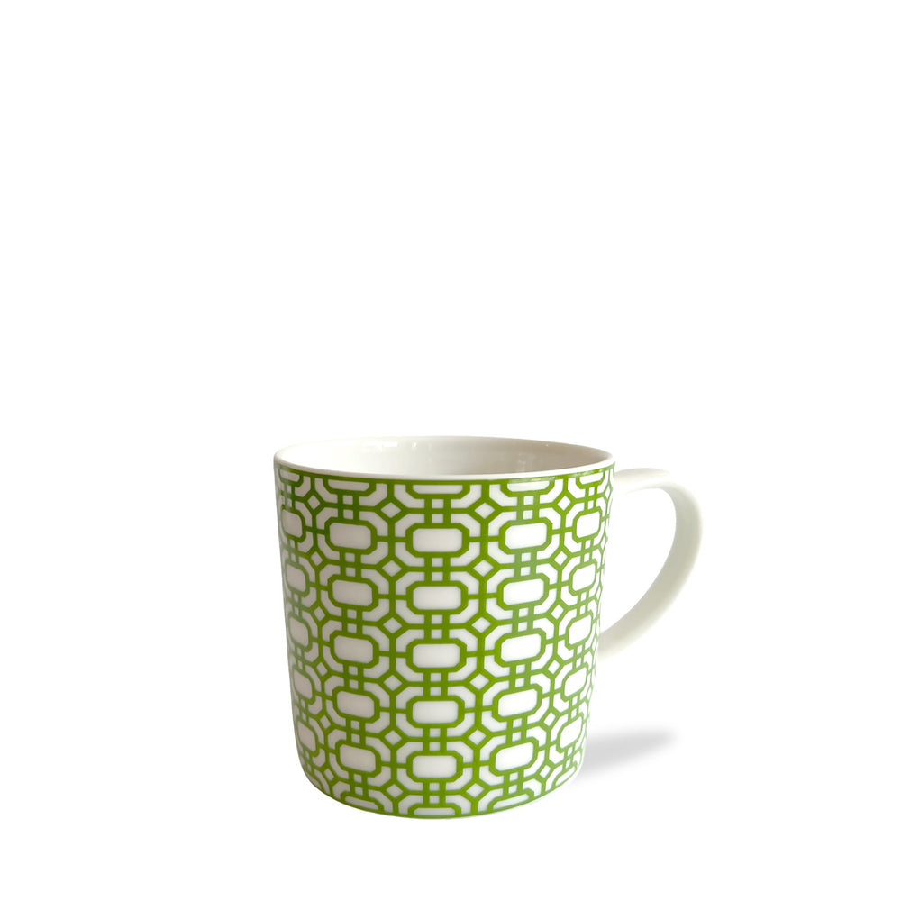 A Newport Garden Gate Verde Mug featuring a white ceramic body adorned with a green chainlink pattern by Caskata Artisanal Home.