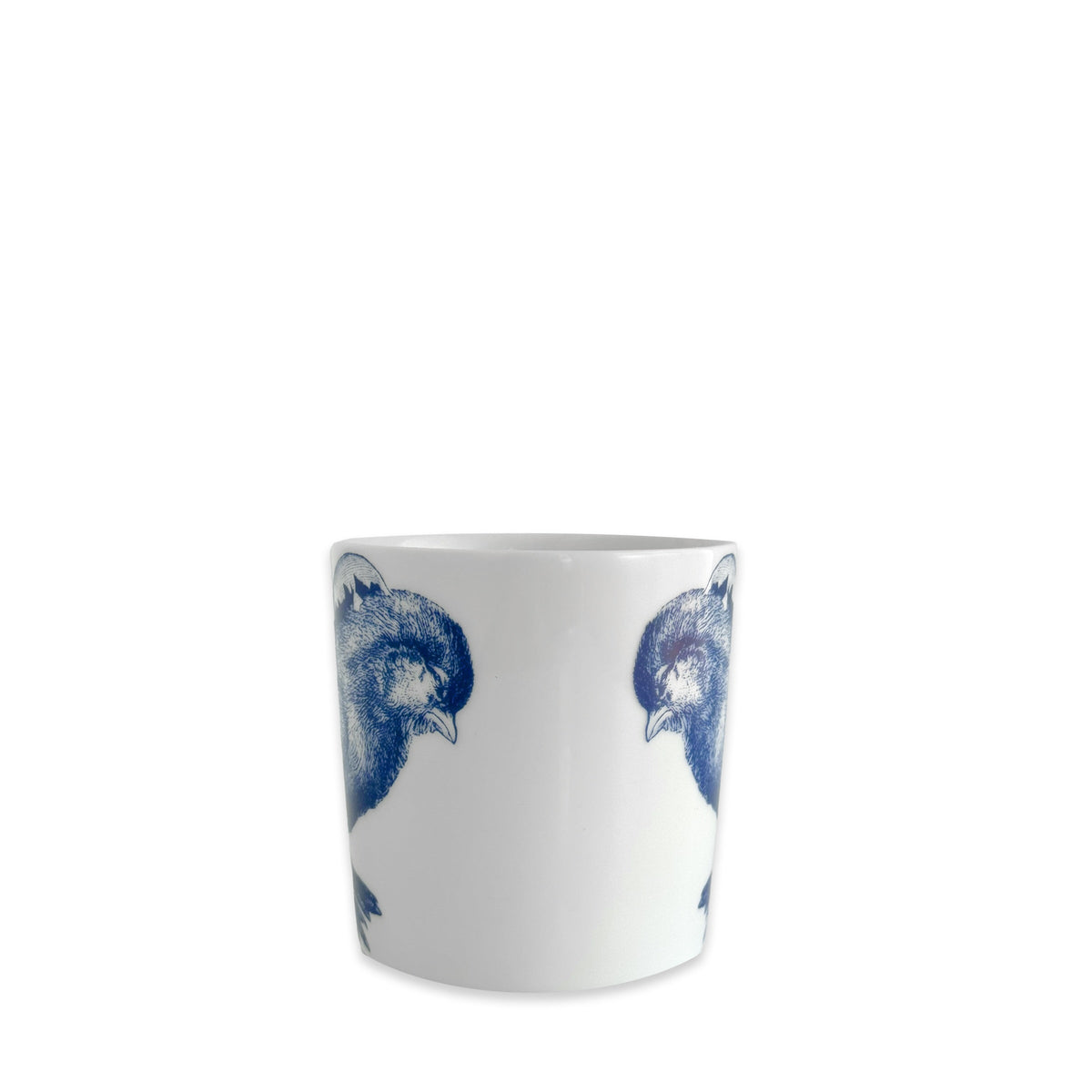 The Grumpy Chick Mug by Caskata is a white high-fired porcelain mug featuring blue illustrations of two grumpy chicks facing each other.