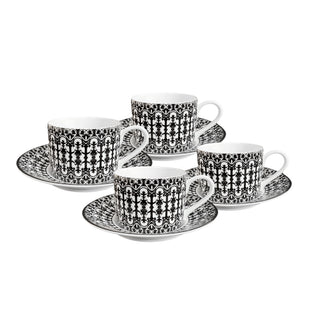 The Caskata Casablanca Cups & Saucers Set of 4 features bone china teacups and matching saucers with a bold black scrollwork design, elegantly displayed on a white background.