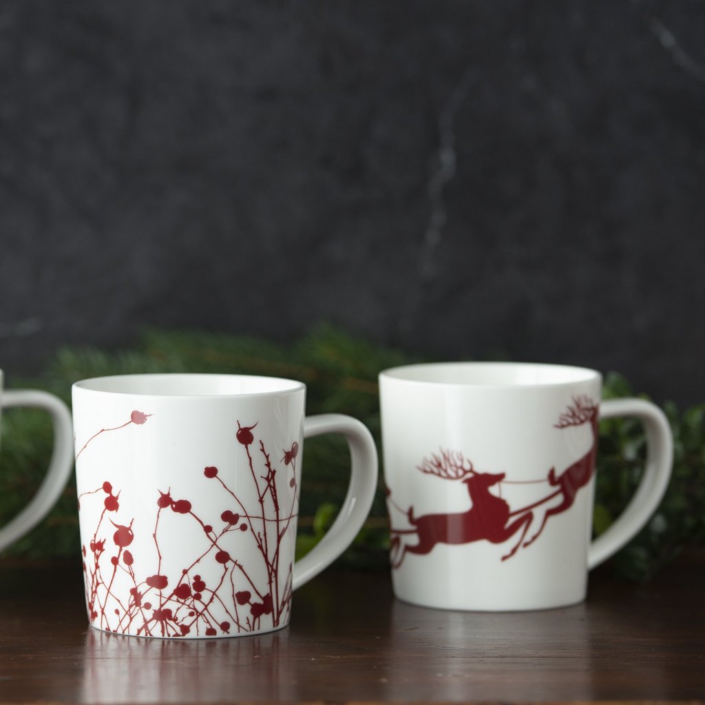 Three Sleigh Mugs with reindeer designs on them, made by Caskata Artisanal Home.
