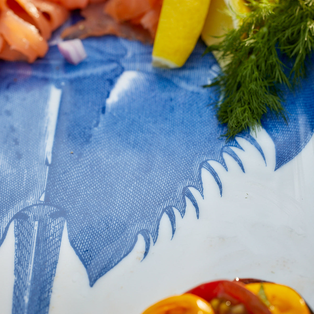 An archival print featuring a Horseshoe Crab Large Coupe Oval Platter from Caskata.