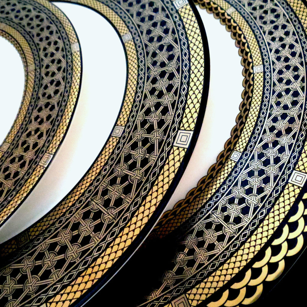 A stunning collection of Hawthorne Onyx Gold &amp; Platinum Bread &amp; Butter Plates by Caskata Artisanal Home, featuring intricate designs, perfect for adding a touch of elegance to any occasion.