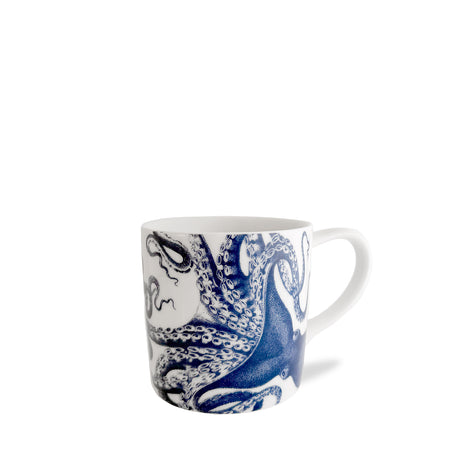 The Lucy Mug by Caskata Artisanal Home features a vivid blue octopus wrapping around white porcelain, perfect for adding coastal charm to your drinkware collection. Shown against a plain white background.