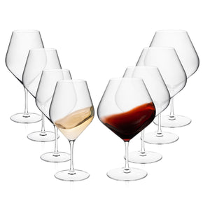 The Caskata Library Wine Lover's Starter Set features eight lead-free crystal glasses arranged in two rows, with one filled with white wine, another with red, and six empty—perfect for new wine lovers.