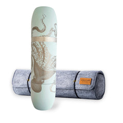 The Caskata X High Camp Flasks Lucy Light Blue Flask and Case Bundle by Caskata features a light blue flask with an octopus design and a gray felt carrying case with brown label—perfect for taking your favorite drinks anywhere.