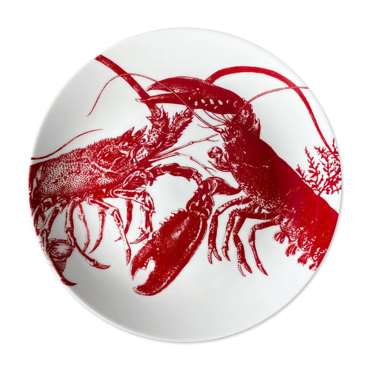 The Caskata Lobster Coupe Dinner Plate features a red illustration of two lobsters and seaweed, making it both dishwasher and microwave safe.