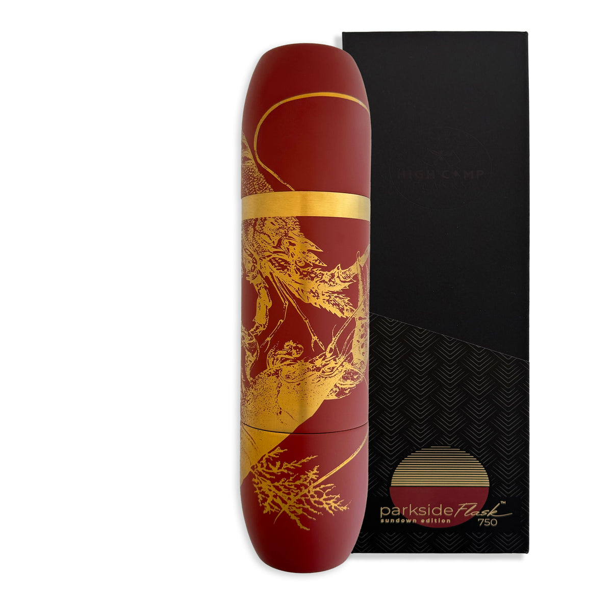 A maroon and gold insulated wine flask with a lobster motif, shown beside its black and gold box labeled &quot;Caskata x High Camp Red Lobster Parkside Flask&quot; by Caskata.
