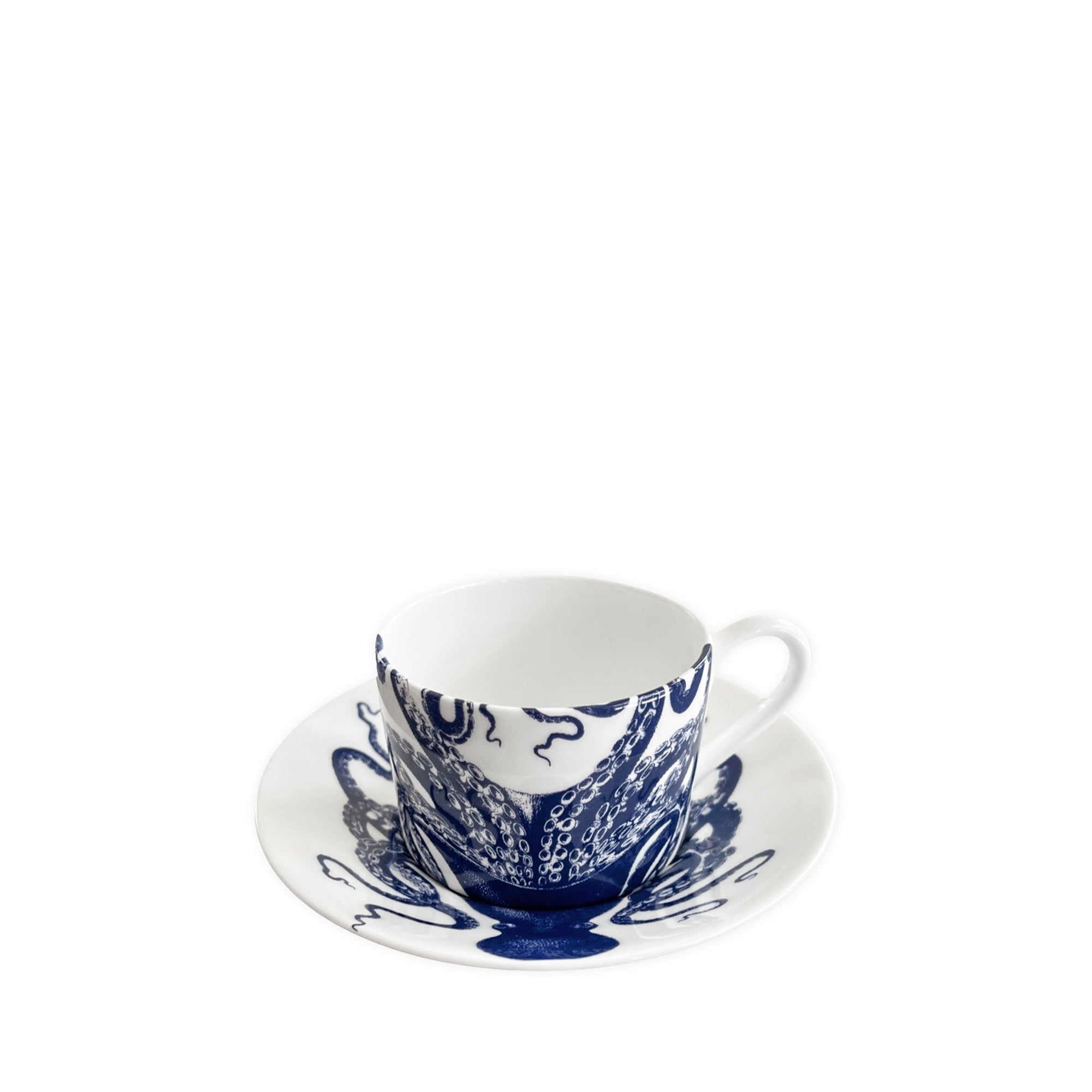 Two white ceramic teacups and saucers featuring charming blue octopus designs, crafted from bone china and dishwasher safe are known as the Lucy Cups & Saucers, Set of 2 by Caskata.