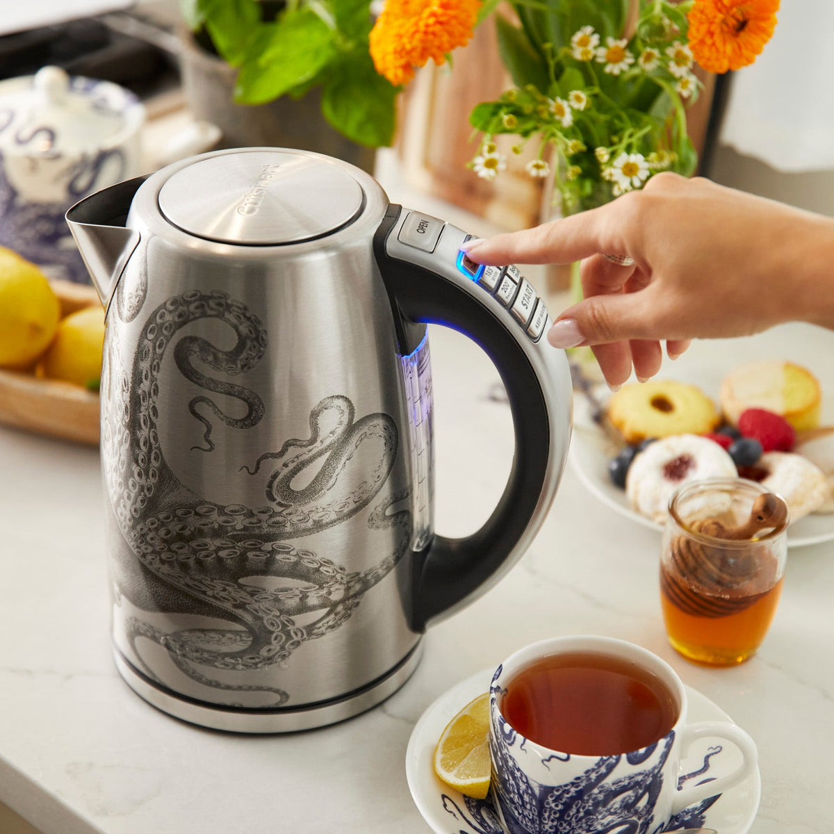 A Caskata X Cuisinart Limited Edition Lucy Programmable Electric Kettle with an octopus on it.