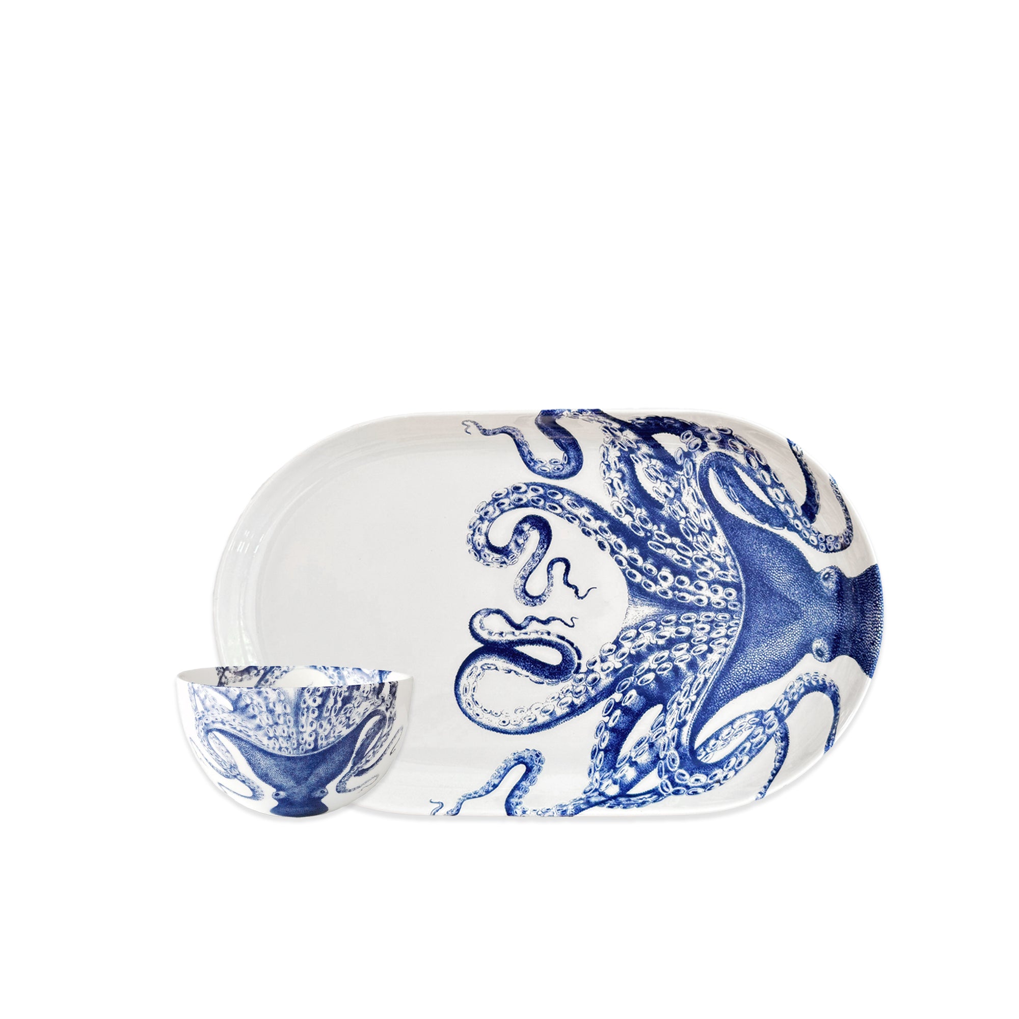The Caskata Lucy Crudité Set features a white ceramic platter and bowl with blue octopus illustrations, adding coastal charm and seaside elegance to your table. Perfect for gatherings or as stylish home decor.
