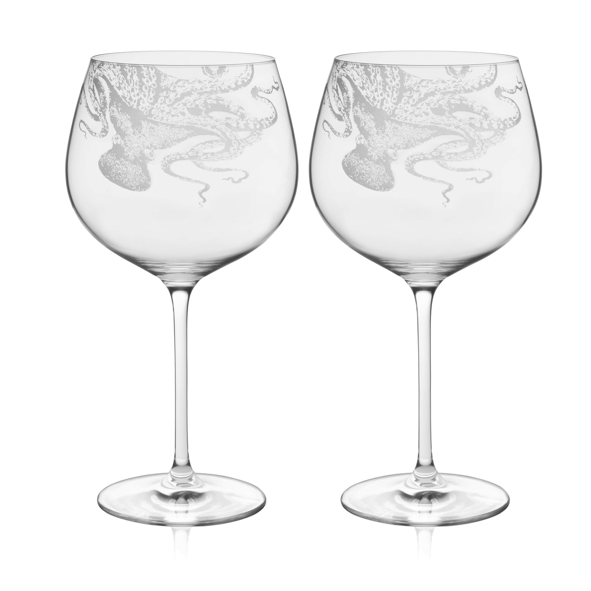 Caskata Lucy Gin &amp; Tonic Glasses—pair of clear, lead-free crystal glasses featuring an etched octopus design wrapping around each bowl.