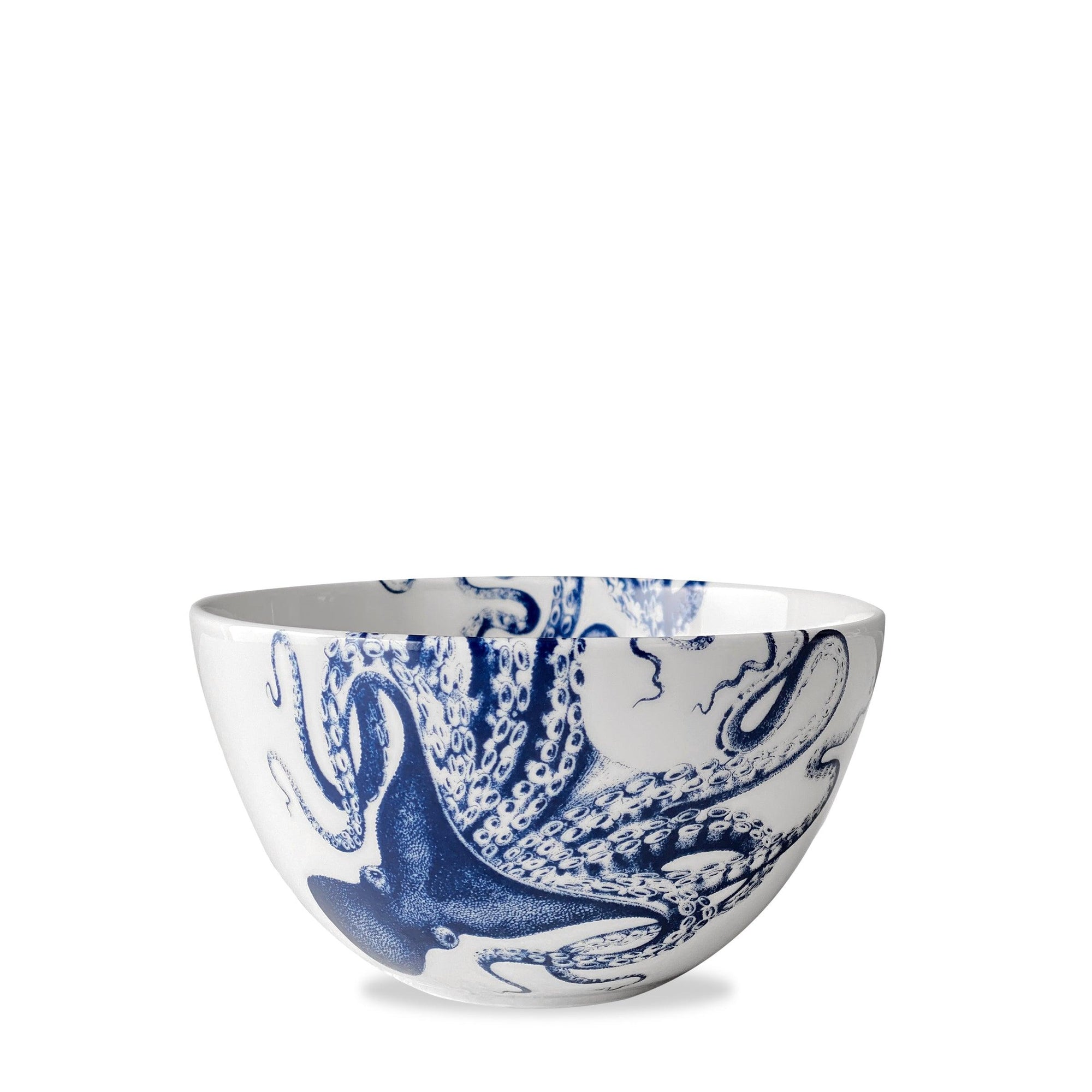 A premium porcelain cereal bowl decorated with a blue octopus design, affectionately known as Lucy the octopus, on the exterior, called the Lucy Cereal Bowl by Caskata.