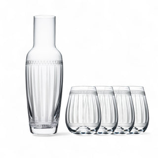 Caskata's A Pour for Friends Bundle features a clear glass carafe with vertical etched lines and four matching lead-free crystal stemless wine glasses, all elegantly displayed on a white background.