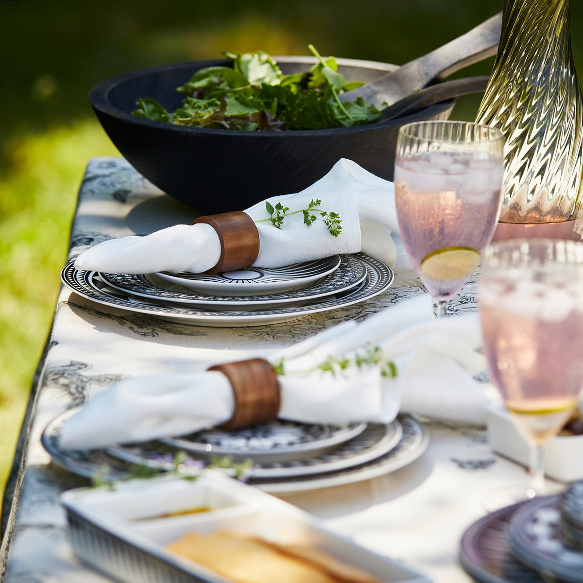 A sustainably sourced Ebonized Oak Handcrafted Salad Tossers tablecloth by Peterman&#39;s.