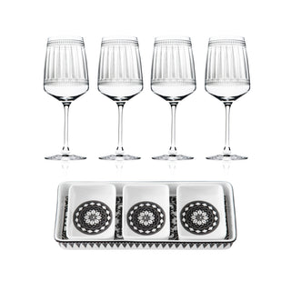 The Caskata Cocktail Hour Bundle includes four red wine glasses and a rectangular appetizer tray with three square dishes, each adorned with a black and white geometric design.