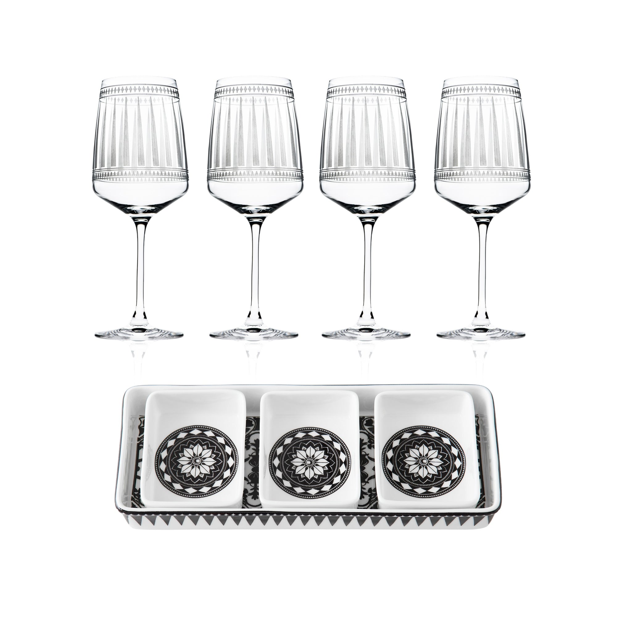 The "Cocktail Hour" Bundle by Caskata features four red wine glasses arranged above a rectangular appetizer tray with three small square dishes, each showcasing a striking black and white geometric design.
