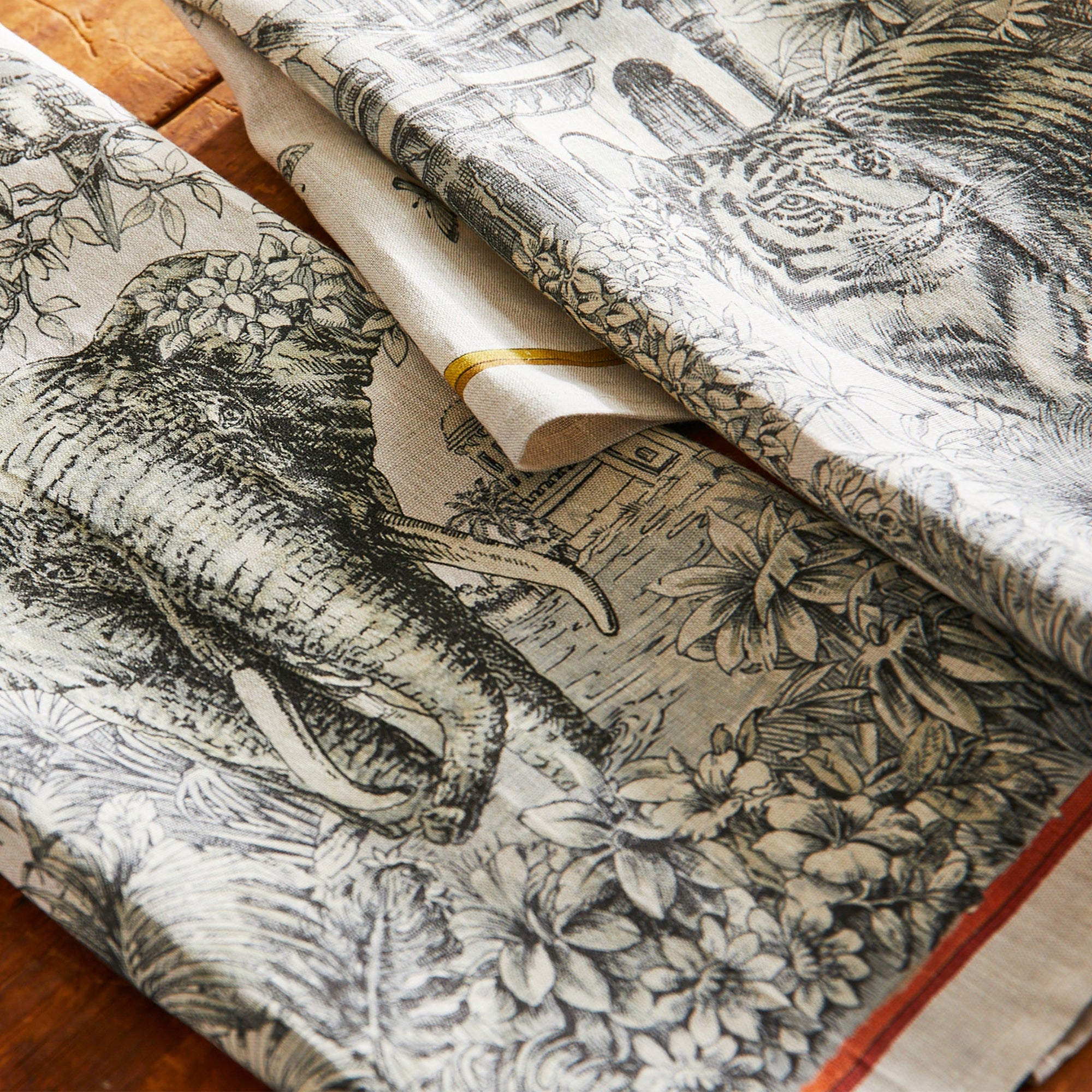 Morocco Kitchen Towels in 100% Italian linen feature black and white foliage, temples, tigers, and elephants in these exotically evocative linens from Caskata